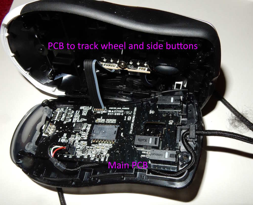 Mouse opened up showing main and side button PCB